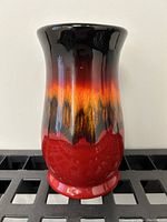 Front view of the glazed art pottery vase showing the color gradient and shape.