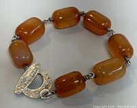 Full view of vintage agate bracelet showing the beads and toggle clasp on a neutral background.