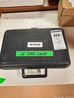 Black plastic carrying case labeled MTCG-SS and WP Centre Gauge