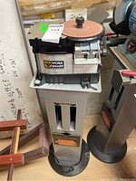 Front view of assembled sharpener on stand showing overall condition