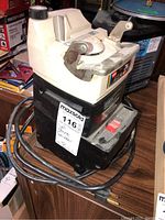 Full side view of the WEN wet stone grinder showing the power switch, cord, and physical condition.