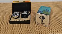 Kodak Brownie Starflex camera outfit in original box with flash reflector and bulb; Bell & Howell camera in box