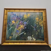 Front view of floral iris painting in gold frame showing vibrant colors and overall condition.