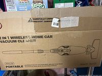 Box with illustration and partial text 2 in 1 wireless home car vacuum cleaner, model Mimo 20