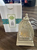 Butterfly Atrium warm ceramic Scentsy warmer displayed with original box, visible electrical cord for warming wax melts.