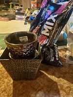 Photo showing two decorative plant pots and a bag of Premier 60/40 Mix potting soil on the floor.