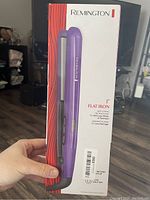 Remington boxed flat iron hair straightener front showing packaging and product image