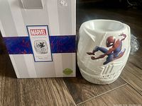 Ceramic Spider-Man Scentsy warmer beside its original white box with Marvel branding.