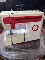 Full view of the Brother sewing machine showing front panel, needle area and stitch selection.