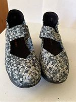 Front view of grey/blue woven elastic platform sandals