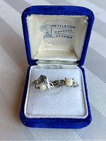 Blue velvet Nettleton Diamonds Ottawa presentation box holding both rings