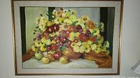 Full view of the framed oil painting showing a floral and fruit still life composition.