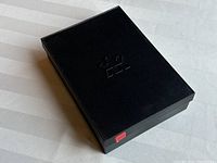 Black box with embossed Royal Canadian Mint logo on top, showing the outer packaging.