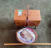 Overview of sewing basket and separate yarn basket with ruler for size reference