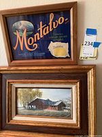 Framed Montalvo Lemons advertising art with colorful vintage lettering and lemon imagery above a small framed landscape painting of a rustic barn.