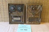 Pair of two bronze US postal box doors; left door has numeral dials and number 1331, right door has sunburst design and numeral lock.