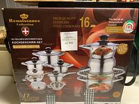 Front of retail box showing full 16-piece set layout, branding and energy-saving badge