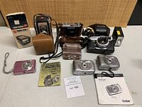 Overview of all cameras, slide viewer, cases and manuals