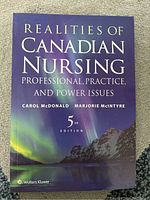 Book cover of 'Realities of Canadian Nursing: Professional, Practice, and Power Issues' 5th edition showing northern lights and mountain scenery, purple cover.
