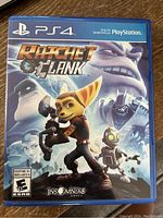 Front cover of Ratchet & Clank PS4 game case showing game title and main character graphics with PS4 logo.