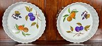 Two Royal Worcester Evesham M medium flan plates showing the fruit decoration and scalloped edges