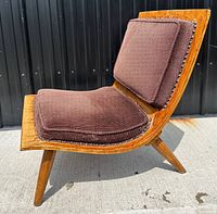 Front-side view of entire chair showing bentwood frame, brown seat and back cushions, and splayed legs