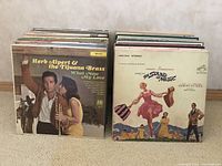 LP assortment showing Herb Alpert & The Tijuana Brass and The Sound of Music soundtrack album covers
