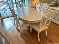 Dining table set with chairs arranged around