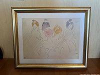 Framed artwork showing four figures sketched with watercolor on textured paper with a gold-tone frame and white mat.