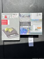 Boxes containing the Taylor digital kitchen scale and the Better Homes & Gardens LED strip light placed side by side.