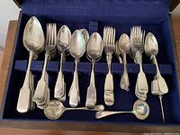 Velvet lined tray with spoons and forks