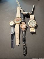 Overview photo of the five ladies watches showing different bands and dial styles.