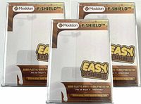 Three sealed Moddan F-SHIELD hard plastic figure protectors in their original packaging, with visible packaging and labeling. One package shows minor cracking on the bottom corner of the protector inside.