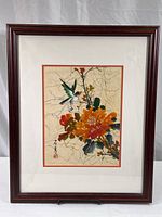 Full view of framed batik silk artwork featuring bird and flower, showing overall condition and presentation.
