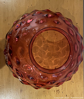 Pink hobnail textured glass lampshade with wide opening showing wear and damage.