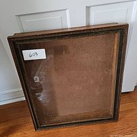 Front view of wood frame display case cabinet with glass front.