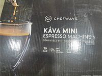 Photo of the CHEFWAVE Kava Mini Espresso Machine box showing product name, brand, and features like compatibility with Nespresso capsules, 20 bar pressure, two cups included, and pod rack included.