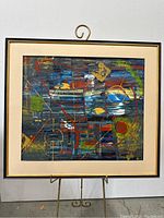 Full view of framed abstract painting showing colors, shapes, and overall composition