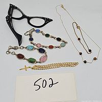 Full lot: cat eye opera glasses, two scarab bracelets, 14K cross charm bracelet, Van Dell gold filled necklace