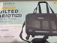 Photo of box showing Katziela Quilted Chariot Pro branding and product description including it being a rolling pet carrier with pet bed.