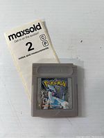 Front view of the Pokémon Silver Version Game Boy cartridge showing label with Lugia artwork and visible wear.
