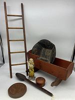 Photo showing entire grouping with cradle, ladder, figure, spoon, box, and butter mold.