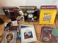 Photo of a collection of vinyl LP albums mostly standing upright showing covers from Gordon Lightfoot, Bee Gees, Neil Sedaka, Anne Murray, James Galway and various educational music albums.