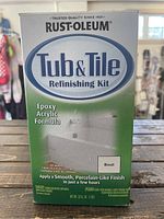 Front of box showing Rust-Oleum brand, product name, biscuit color, epoxy acrylic formula, and refinishing kit details.