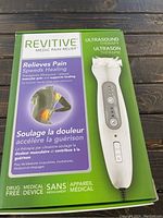 Front box of the ultrasound therapy device showing brand, benefits, and device image