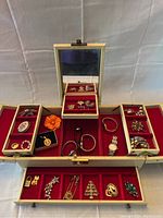 Open jewelry box with mirror and all compartments