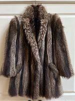 Full front view of the 3/4 length fur coat showing collar, sleeves, and texture.