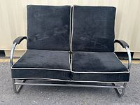 Front view of black mohair loveseat on chrome frame