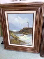 Framed painting of lighthouse scene signed Engel, includes wooden frame and mat, 19 x 23.5 inches