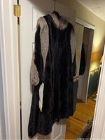Full view of coat hanging on door